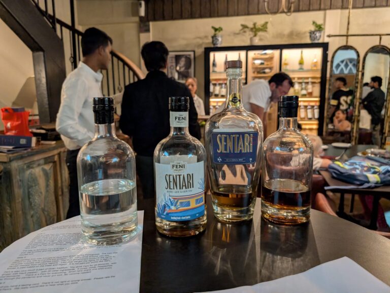 A lineup of Sentari and Feni bottles on a tasting table